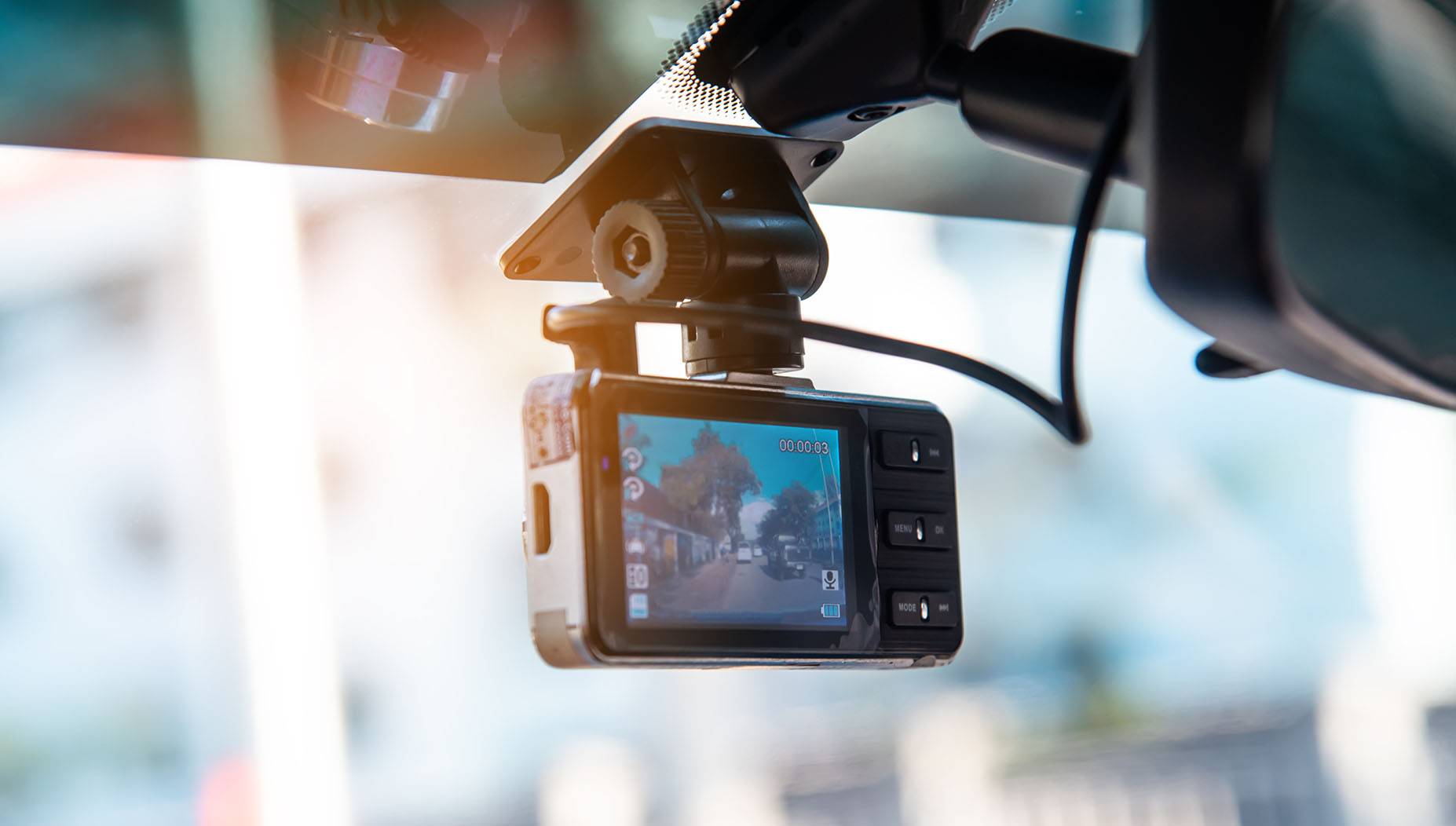 dash cam hanging on windshield